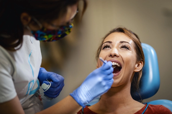 A patient during a check-up with a restorative dentist in the West Coast area.